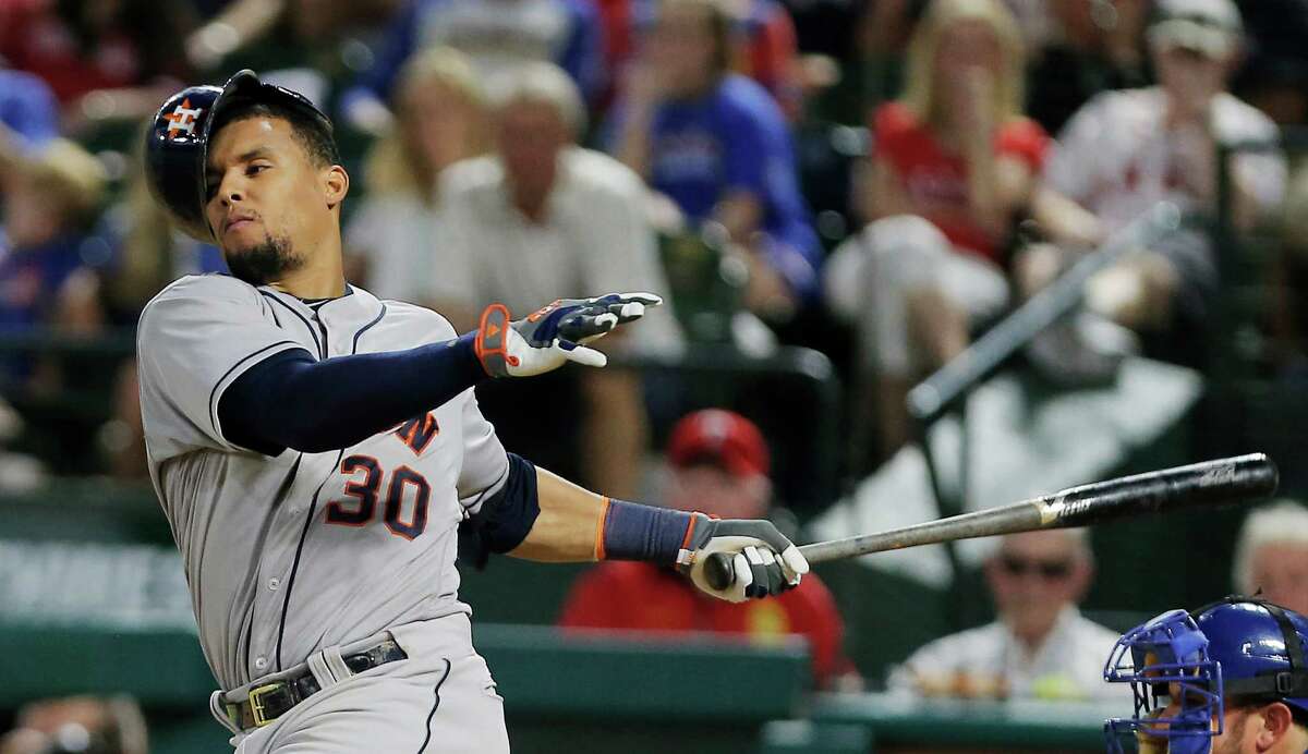 Houston Astros Carlos Gomez's (30) helmet falls off after swinging at a pitch in the ninth inning of a baseball game against the Texas Rangers, Tuesday, June 7, 2016, in Arlington, Texas. Texas won 4-3. (AP Photo/Brandon Wade)