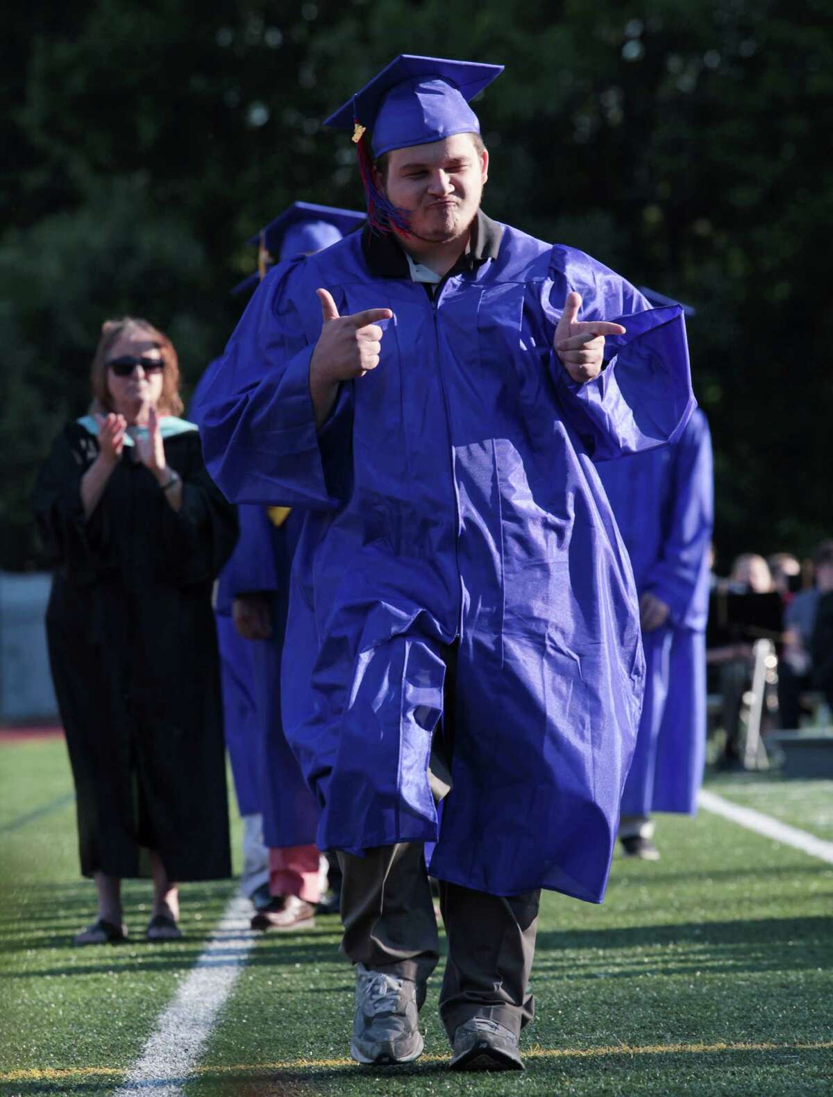 Hunter Quaid Stanford reacts before receiving his diploma at the Joseph A. Foran High School graduation ceremony in Milford, Conn. on Thursday, June 9, 2016.