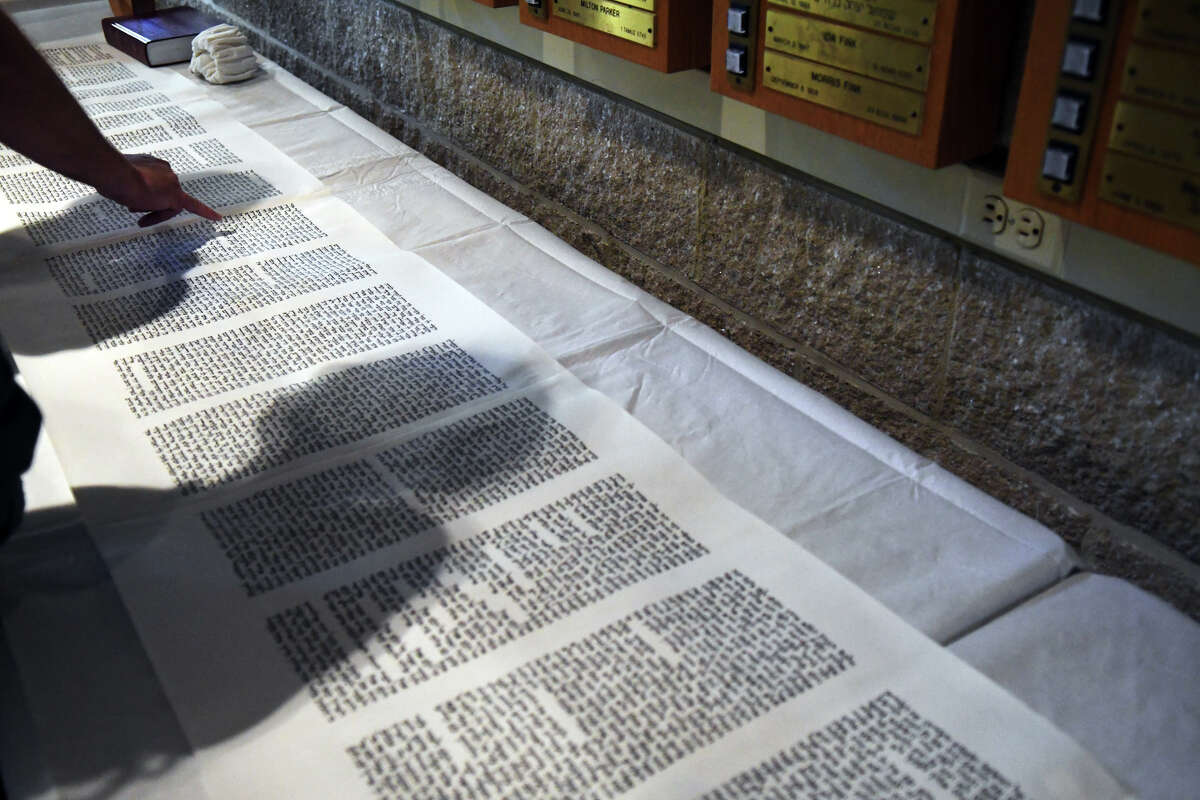 Temple Sholom celebrates its centennial with a formal dedication ceremony for a new Sefer Torah at the Temple in Greenwich, Conn., June 9, 2016. The Torah was written by a scribe in Israel but congregants were able to contribute to the writing through scheduled appointments over the course of the past year it took to write. The new scroll is lighter than the others in the collection, making it suitable for bar and bat mitvah ceremonies. This is the first time a new Torah has been added to the Temple's collection since the early 1990s.