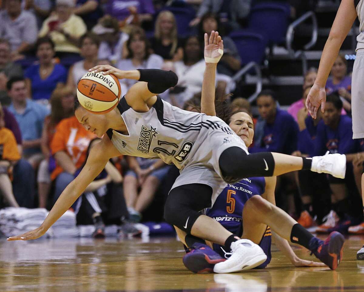 San Antonio Stars' Kayla McBride (21) and Phoenix Mercury's Sonja Petrovic collide during the first half of a WNBA basketball game Thursday, June 9, 2016, in Phoenix. (Patrick Breen/The Arizona Republic via AP) MANDATORY CREDIT