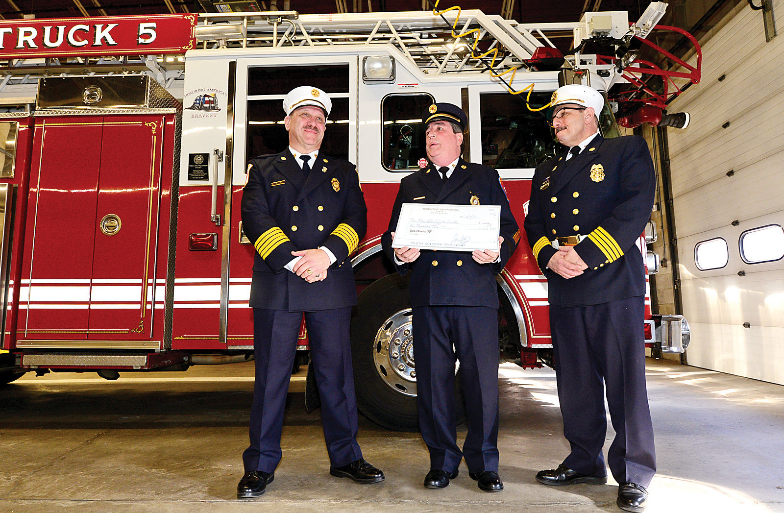 Wilton fire chief accepts check to help fallen firefighters