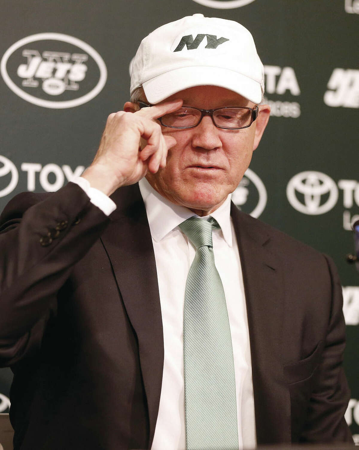 New York Jets owner Woody Johnson announces the firing of head coach Rex Ryan and general manager John Idzik at the team's practice facility in Florham Park, N.J., Monday, Dec. 29, 2014. (AP Photo/Rich Schultz)