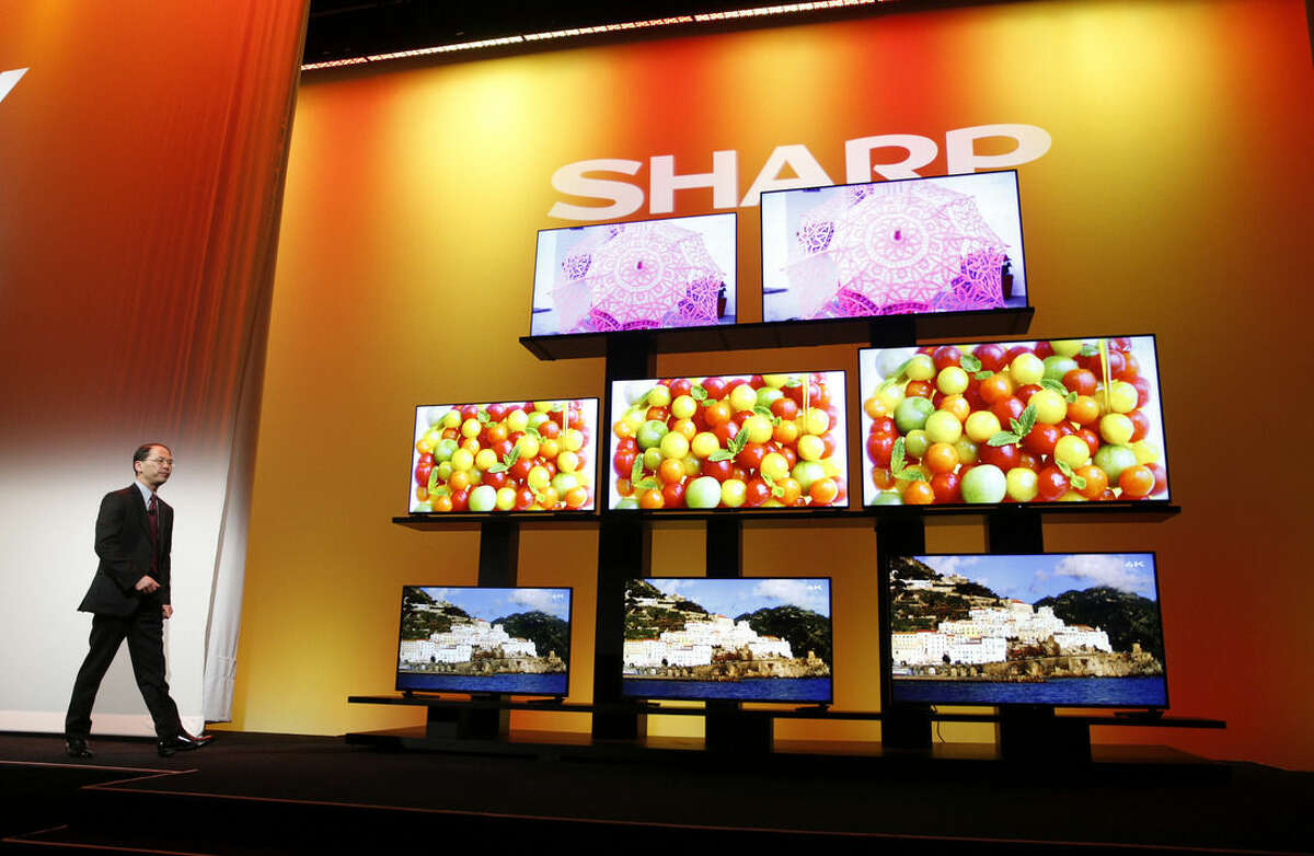 Toshiyuki Osawa, president of Sharp Electronics Corporation, introduces Sharp 4K Ultra HD televisions Monday, Jan. 5, 2015, in Las Vegas. Also known as Ultra HD, 4k offers four times the sharpness of today's high-definition video. (AP Photo/John Locher)