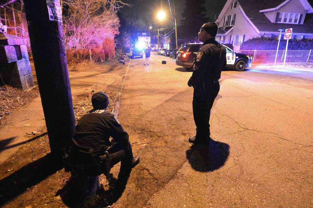 Hour Photo/Alex von Kleydorff Norwalk Police investigate an area on Sheridan St Friday night, possibly connected to a shooting in the area