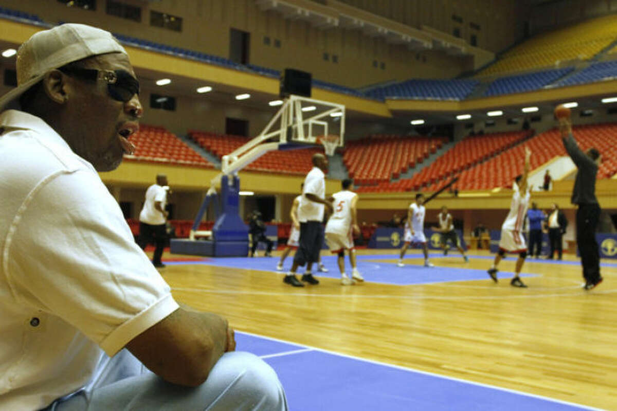 Dennis Rodman watches court side as North Korean and U.S. basketball players practice in Pyongyang, North Korea on Tuesday, Jan. 7, 2014. Rodman came to the North Korean capital with a squad of U.S. basketball stars for an exhibition game on Jan. 8, the birthday of North Korean leader Kim Jong Un. (AP Photo/Kim Kwang Hyon)