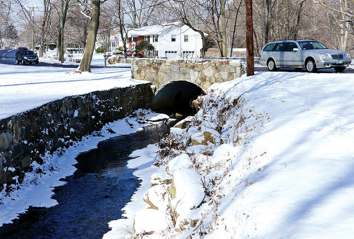 Hour photo / Erik Trautmann Culvert for Keeler Brook at Rowayton Ave. Norwalk looking to buy property at 405 Rowayton Ave. to widen Keeler Brook as part of a long-planned flood mitigation project.