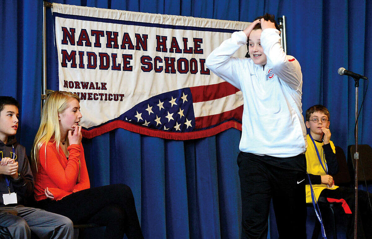 Hour photo / Erik Trautmann Nathan Hale Middle School 8th grader, Nic DiIorio, reacts after competing in the schoolwide Geography Bee Thursday.