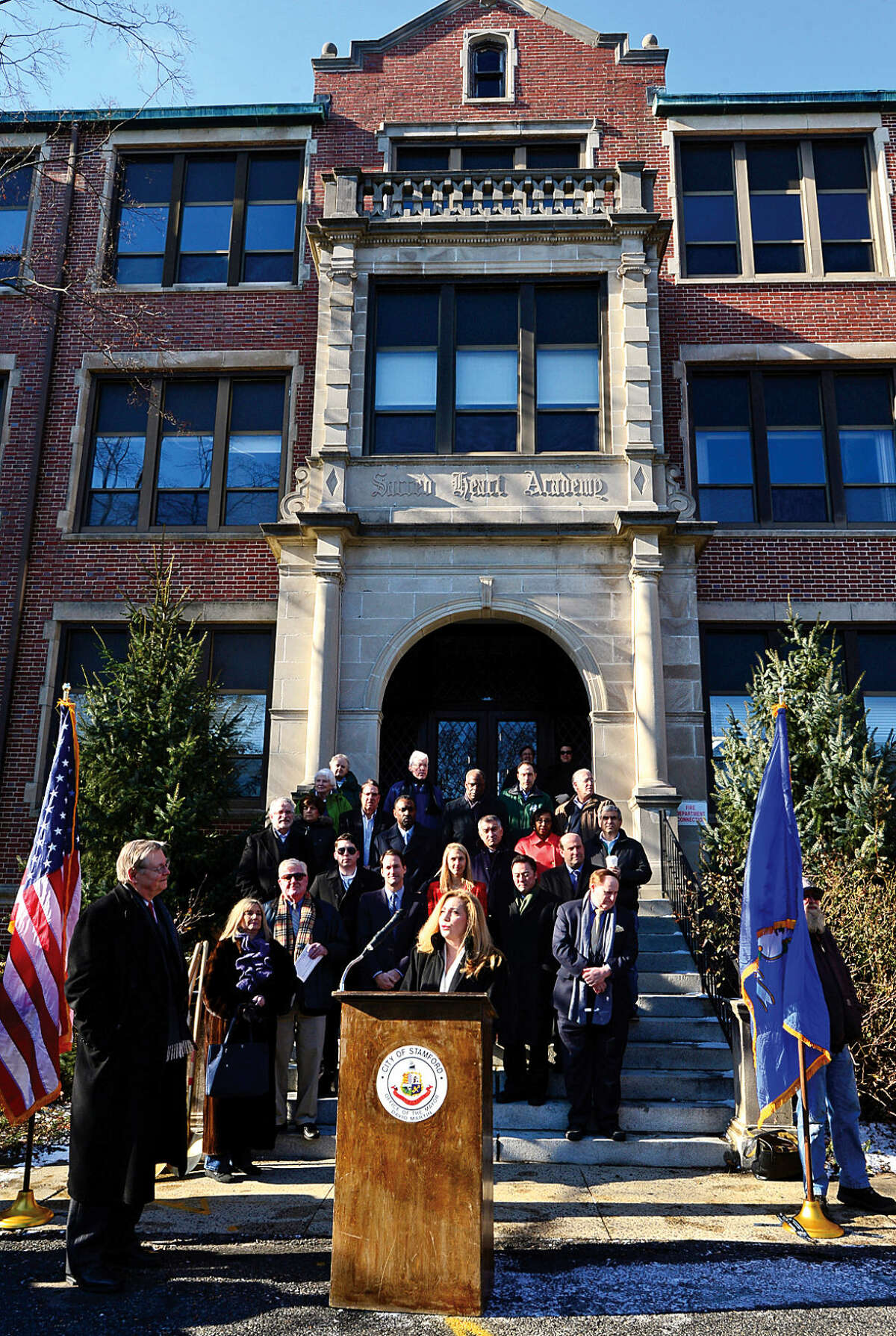 Hour photo / Erik Trautmann Stamford Mayor David Martin is joined by Connecticut DEputy Commissioner fo Administrative Services, Toni Fatone, who speaks during the groundbreaking ceremony for the new school at the site of the former Sacred Heart Academy Thursday morning.