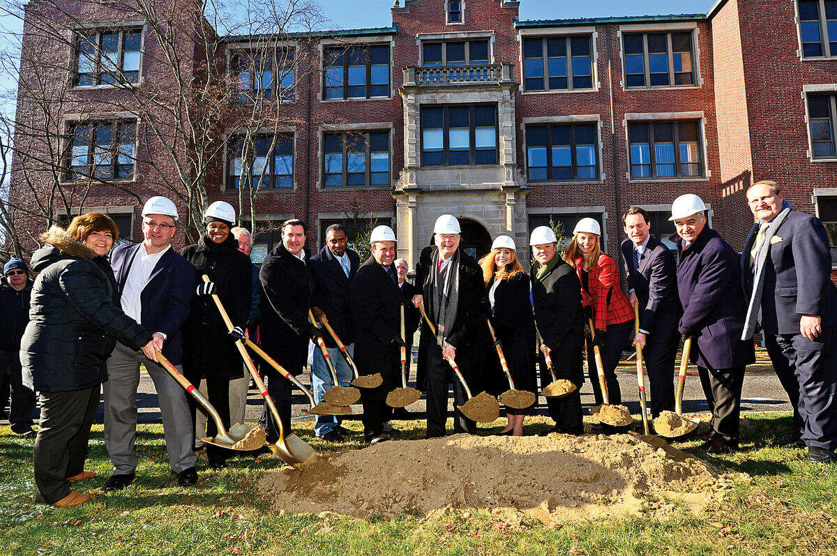 Mayor David Martin, center, is joined by local officials and state representatives for the groundbreaking ceremony of the new school at the site of the former Sacred Heart Academy Thursday morning.
