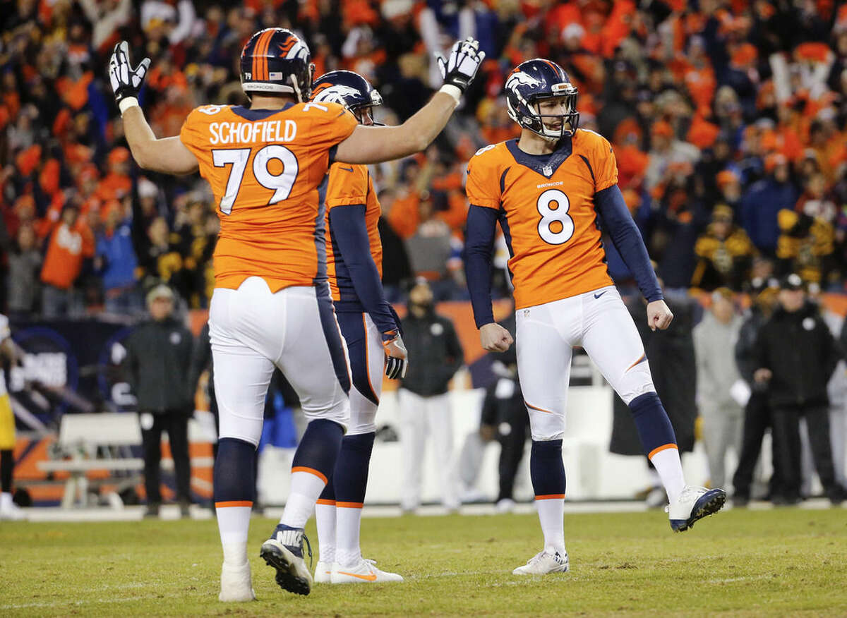 Denver Broncos kicker Brandon McManus, right, celebrates after kicking a field goal with tackle Michael Schofield, left, and Britton Colquitt, center, during the second half in an NFL football divisional playoff game, Sunday, Jan. 17, 2016, in Denver. (AP Photo/Jack Dempsey)