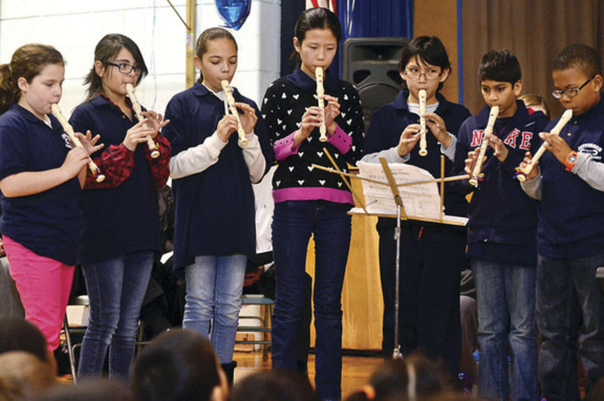 Hour photo / Erik Trautmann The Jefferson Science Magnet School Black Belt Recorder Players play Ode to Joy as the school celebrates the National Blue Ribbon Award they received for closing the achievement gap between student sub-groups during a ceremony Tuesday morning.