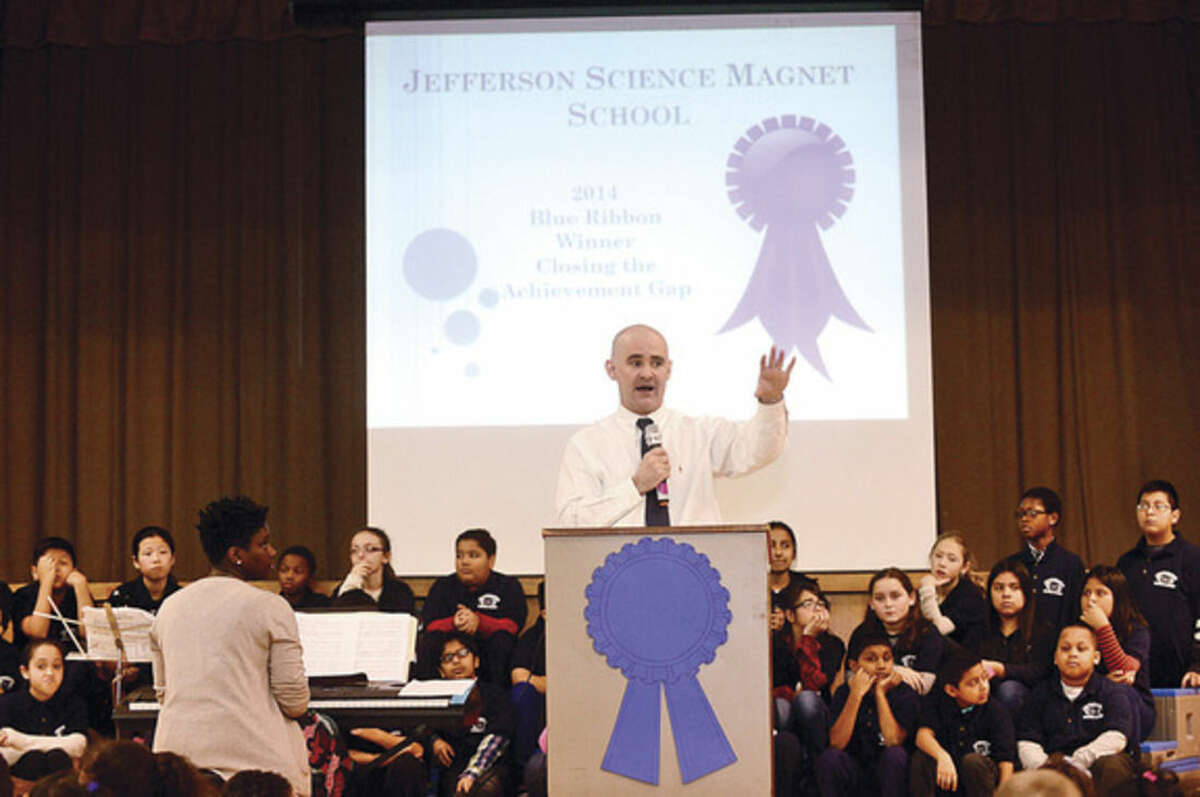 Hour photo / Erik Trautmann Jefferson Science Magnet School principal John Reynolds speaks to the students, faculty and guests as the school celebrates the National Blue Ribbon Award they received for closing the achievement gap between student sub-groups during a ceremony Tuesday morning.