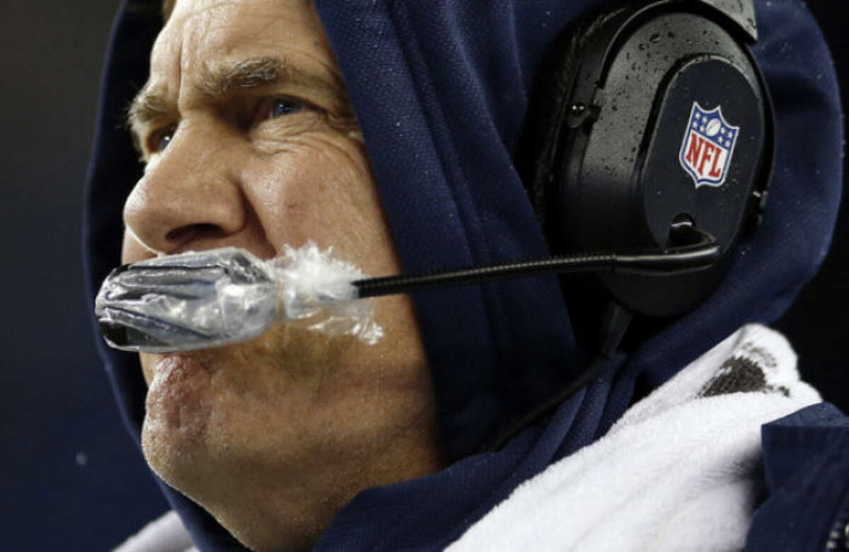 New England Patriots head coach Bill Belichick watches the action on the field during the first half of an AFC divisional NFL playoff football game against the Indianapolis Colts in Foxborough, Mass., Saturday, Jan. 11, 2014. (AP Photo/Michael Dwyer)