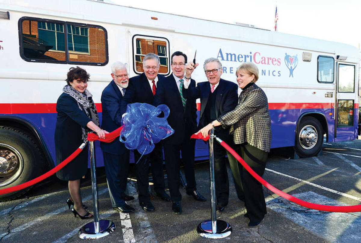 Stella Smith of Quest Diagnostics, David Smith of Stamford Hospital, Stamford Mayor David Martin, Gov. Dannel P. Malloy and Karen Gottlieb, Executive Director of AmeriCares Free Clinic attend a Ribbon Cutting and Opening Celebration for the AmeriCares Free Clinic of Stamford. The mobile clinic will serve low-income residents of Stamford and Darien ages 18 and older without health insurance.