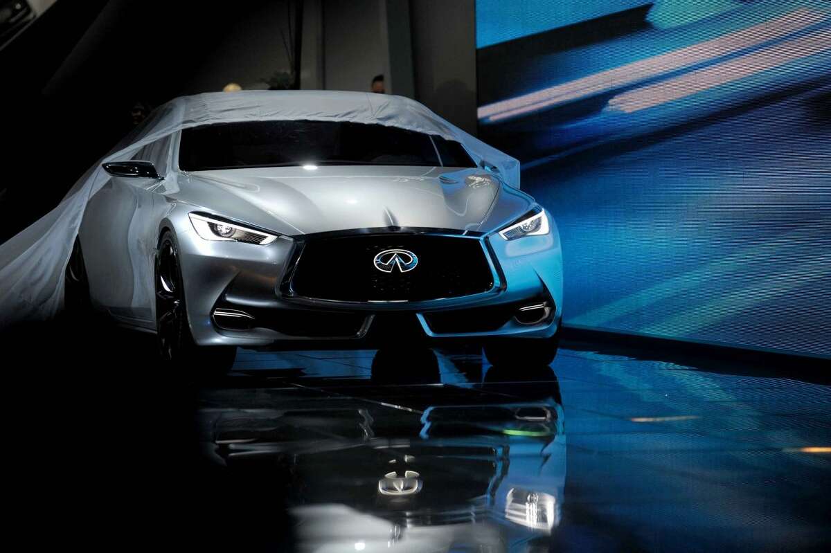 The Infiniti Q60 concept car is presented during media previews for the North American International Auto Show in Detroit, Tuesday, Jan. 13, 2015. (AP Photo/The Grand Rapids Press, Tanya Moutzalias) ALL LOCAL TELEVISION OUT; LOCAL TELEVISION INTERNET OUT