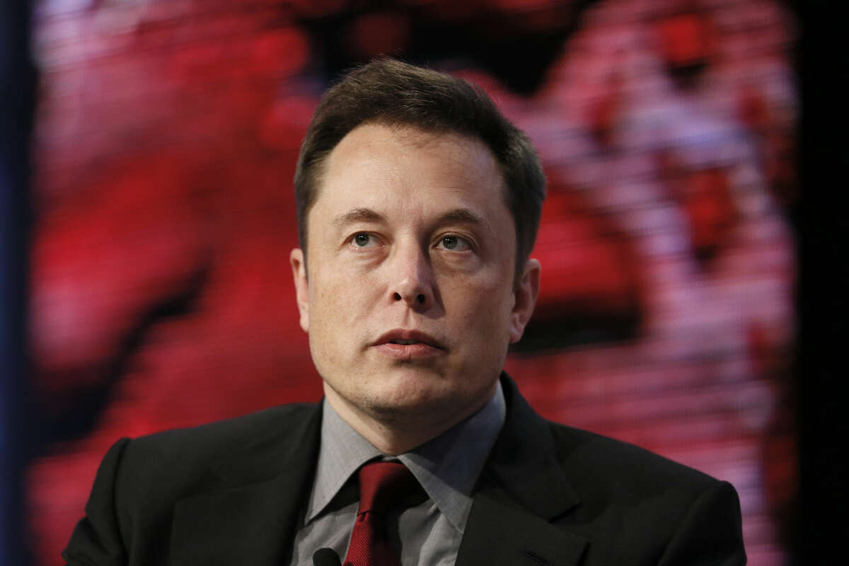 Elon Musk, Tesla Chairman, Product Architect and CEO, speaks at the Automotive News World Congress in Detroit Tuesday, Jan. 13, 2015. (AP Photo/Paul Sancya)
