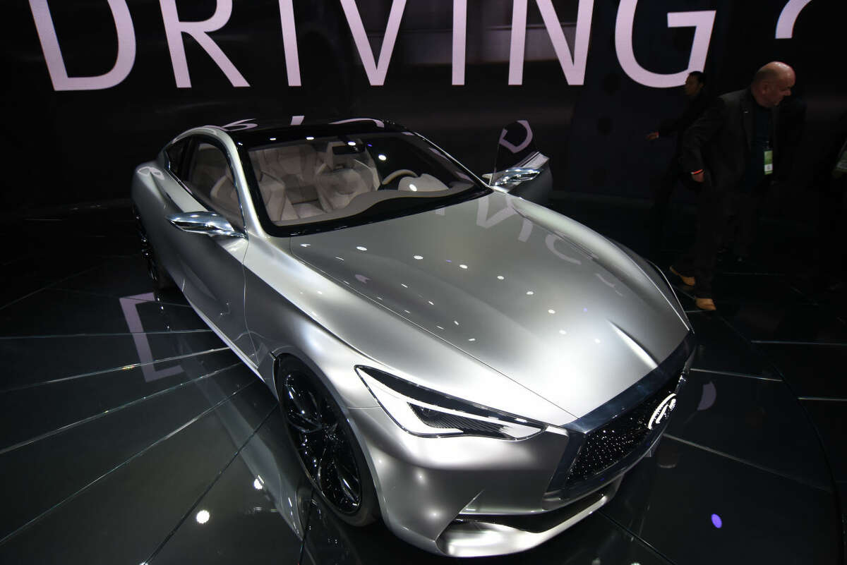 The Infiniti Q60 concept car is presented during media previews for the North American International Auto Show in Detroit, Tuesday, Jan. 13, 2015. (AP Photo/The Grand Rapids Press, Tanya Moutzalias) ALL LOCAL TELEVISION OUT; LOCAL TELEVISION INTERNET OUT