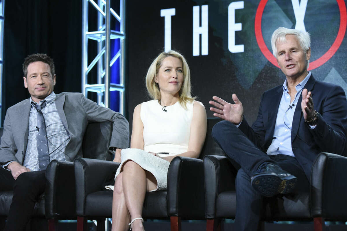 Photo by Richard Shotwell/Invision/AP, File In this Friday, Jan. 15, file photo, actors David Duchovny, from left, Gillian Anderson and creator/executive producer Chris Carter participate in "The X Files" panel at the Fox Winter TCA in Pasadena, Calif.