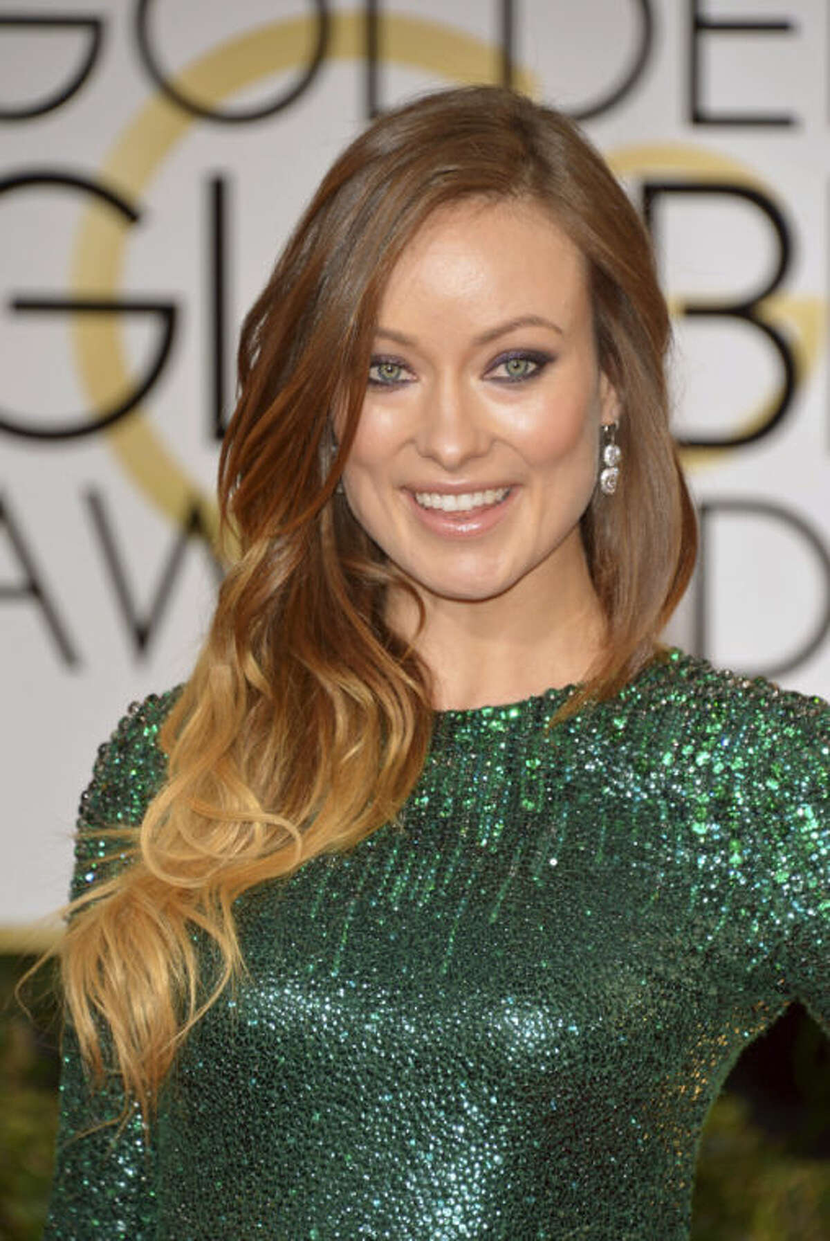 Olivia Wilde arrives at the 71st annual Golden Globe Awards at the Beverly Hilton Hotel on Sunday, Jan. 12, 2014, in Beverly Hills, Calif. (Photo by John Shearer/Invision/AP)