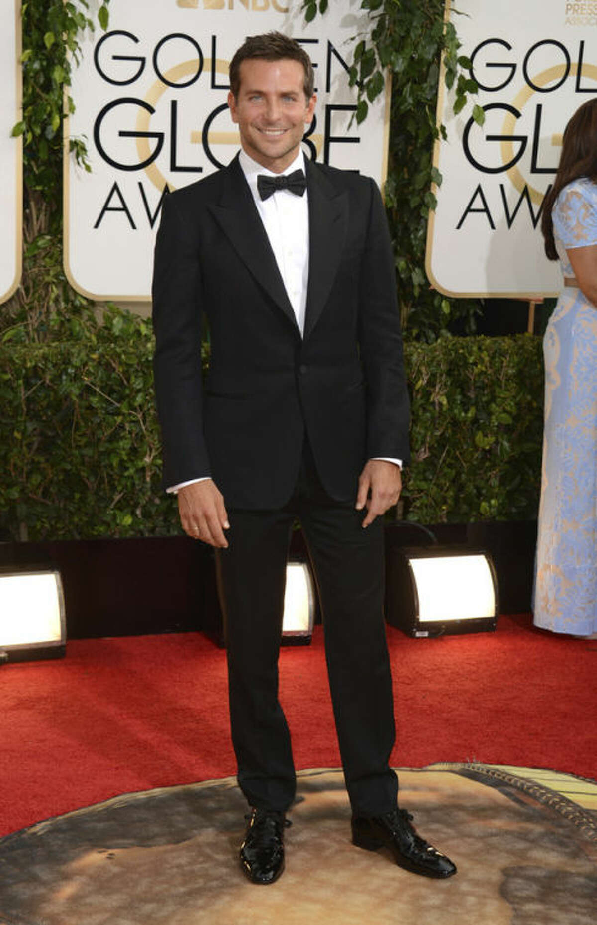 Bradley Cooper arrives at the 71st annual Golden Globe Awards at the Beverly Hilton Hotel on Sunday, Jan. 12, 2014, in Beverly Hills, Calif. (Photo by Jordan Strauss/Invision/AP)
