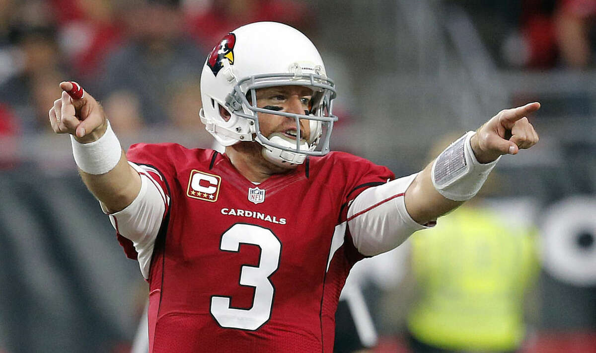 FILE - In this Jan. 3, 2016, file photo, Arizona Cardinals quarterback Carson Palmer (3) calls a play against the Seattle Seahawks during the first half of an NFL football game, in Glendale, Ariz. Arizona and Carolina play in the NFC Championship game on Sunday, Jan. 24, in Charlotte, N.C. (AP Photo/Ross D. Franklin)