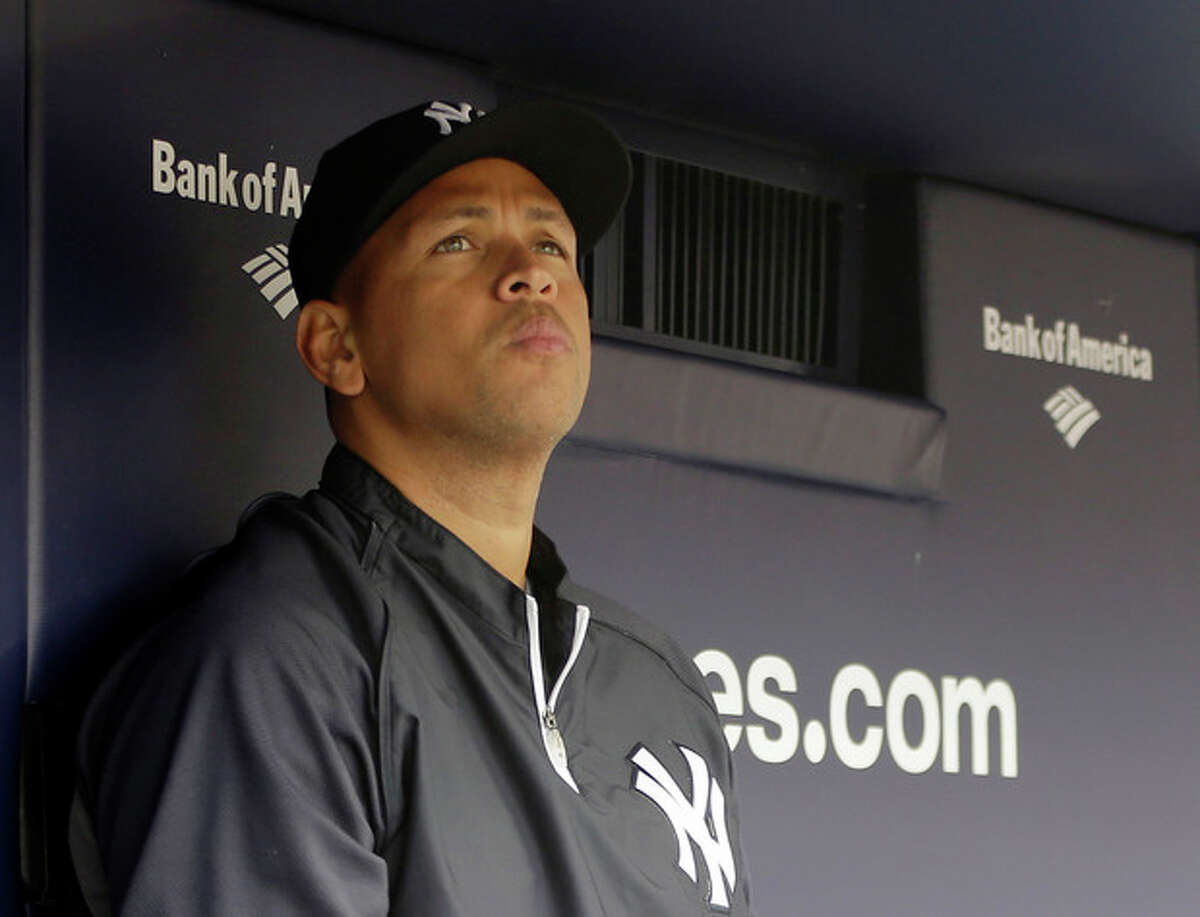 FILE - In this April 13, 2013, file photo, New York Yankees' Alex Rodriguez sits in the dugout during a baseball game at Yankee Stadium in New York. Rodriguez sued Major League Baseball and Commissioner Bud Selig in a lawsuit, filed Thursday, Oct. 3, 2013, in New York State Supreme Court, accusing them of pursuing "vigilante justice" as part of a "witch hunt" designed to smear the character of the Yankees star and cost him tens of millions of dollars. (AP Photo/Kathy Willens, File)