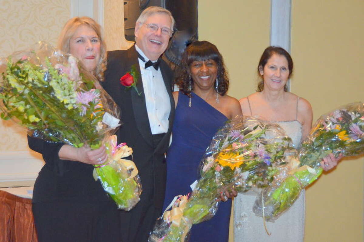 Mayor David Martin presented floral bouquets to the three co-chairs of the Inaugural Ball. From left to right are: Claudia Silver, Gloria DePina and Philomena Mallozzi. 