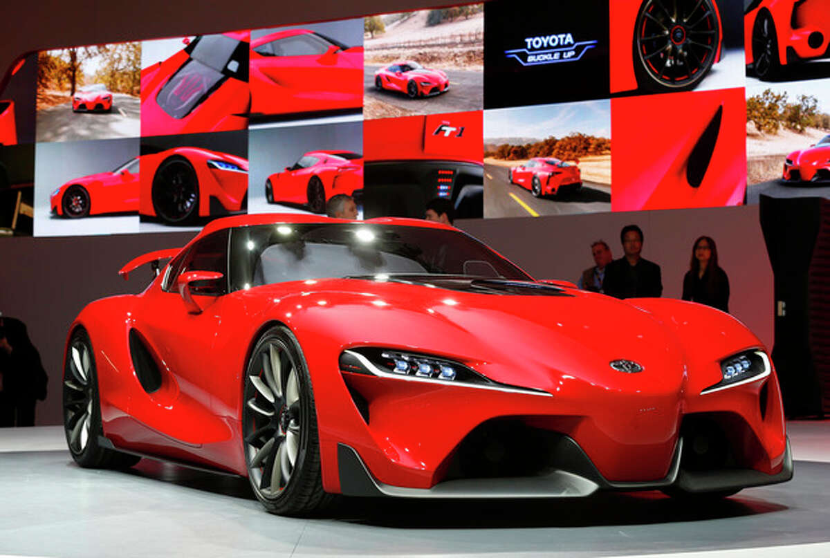 The Toyota FT-1 concept is unveiled during media previews during the North American International Auto Show in Detroit, Monday, Jan. 13, 2014. (AP Photo/Paul Sancya)