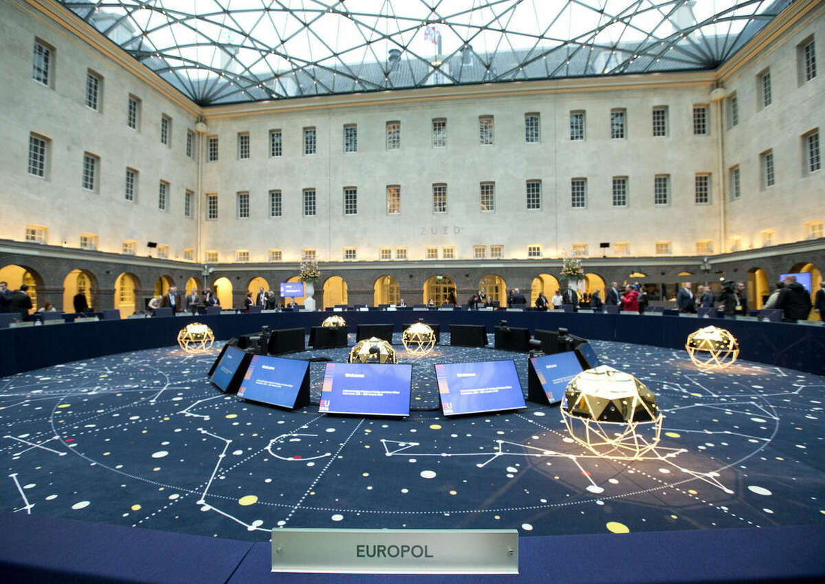 View of the conference room and the seat of Europol director Rob Wainwright at the Maritime museum prior to an informal meeting of EU Justice and Home Affairs ministers at the Maritime Museum in Amsterdam, Netherlands, Monday, Jan. 25, 2016. European Union justice and interior ministers have started urgent discussions on how to tackle the migrant crisis amid the stream of new arrivals and continuing disagreements over how to seal off borders. (AP Photo/Peter Dejong)
