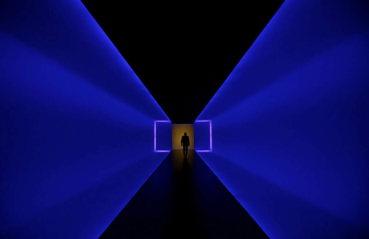 A man walks through a tunnel that connects two buildings of the Museum of Fine Arts, Houston, Tuesday, Jan. 13, 2015, in Houston. The tunnel, titled The Light Inside, is a work by American artist James Turrell. (AP Photo/Pat Sullivan)