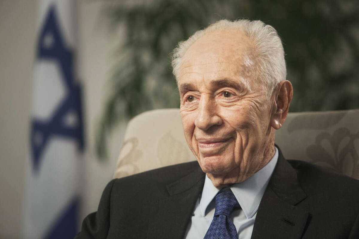 FILE - In this Nov. 2, 2015 file photo, former Israeli President Shimon Peres speaks during an interview with The Associated Press in Jerusalem. A spokeswoman for Israel's former President Shimon Peres says the 92-year-old is being rushed to hospital after experiencing chest pains it was reported on Sunday, Jan. 24, 2016. (AP Photo/Dan Balilty, File)