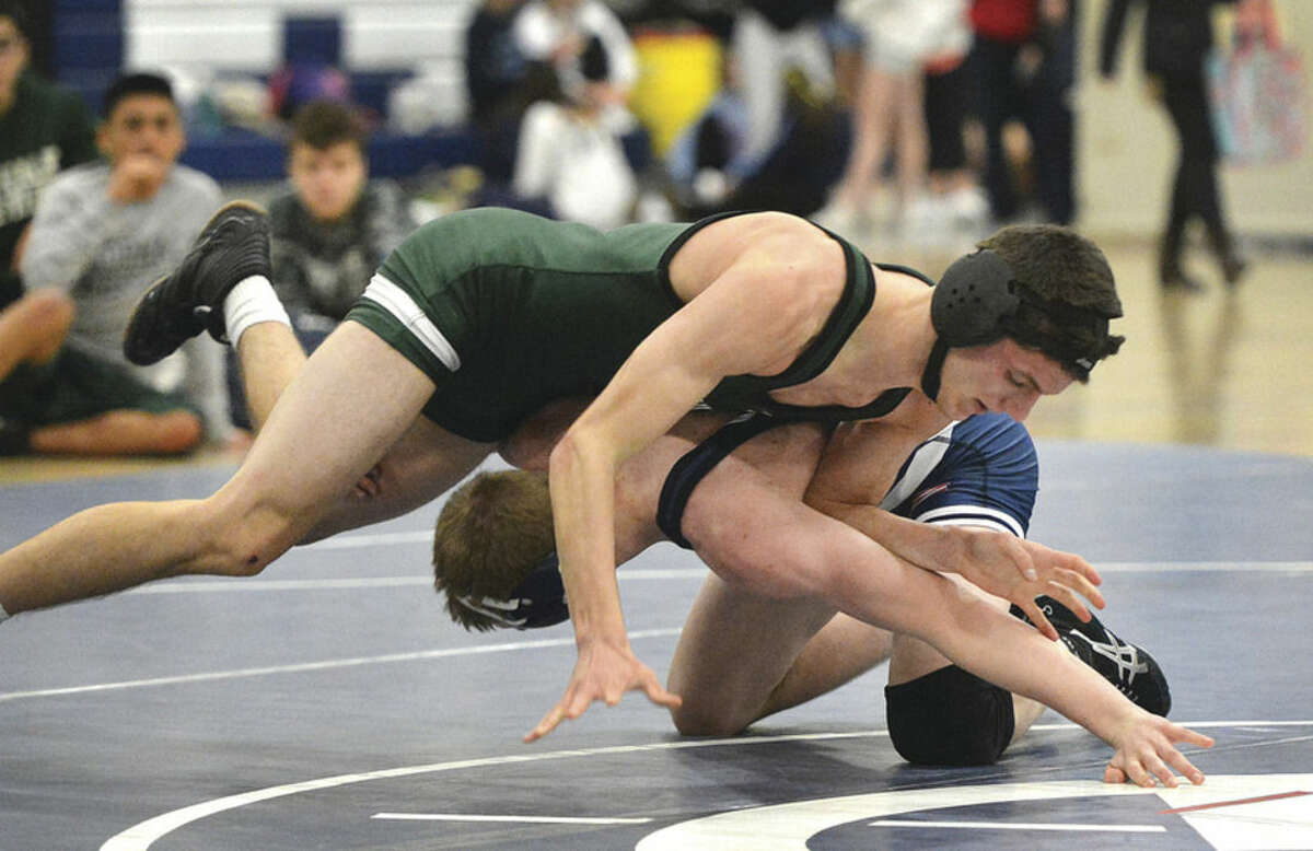 Hour photo/Alex von Kleydorff Norwalk's John Koletsos has the upper hand over Wilton's Harry Winrow in the 152-pound bout during Wednesday's dual meet at Wilton High. Koletsos won his bout but the Bears lost to the Warriors 53-27.