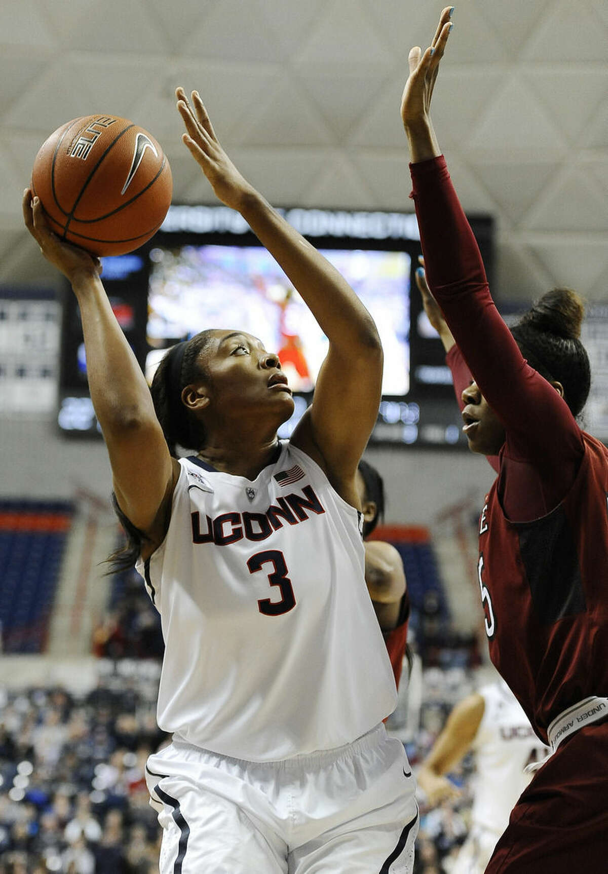 Connecticut’s Morgan Tuck goes up for a basket as Temple’s Safiya Martin, right, defends during the first half of an NCAA college basketball game, Wednesday, Jan. 14, 2015, in Storrs, Conn. (AP Photo/Jessica Hill)
