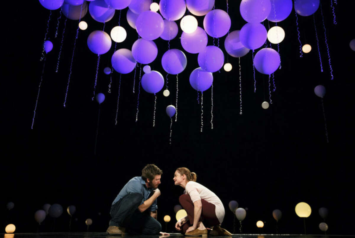 This publicity photo released by Boneau/Bryan-Brown shows, from left, Jake Gyllenhaal and Ruth Wilson, in a scene from Nick Payne’s "Constellations," currently performing on Broadway at the Samuel J. Friedman Theatre in New York. (AP Photo/Boneau/Bryan-Brown, Joan Marcus)