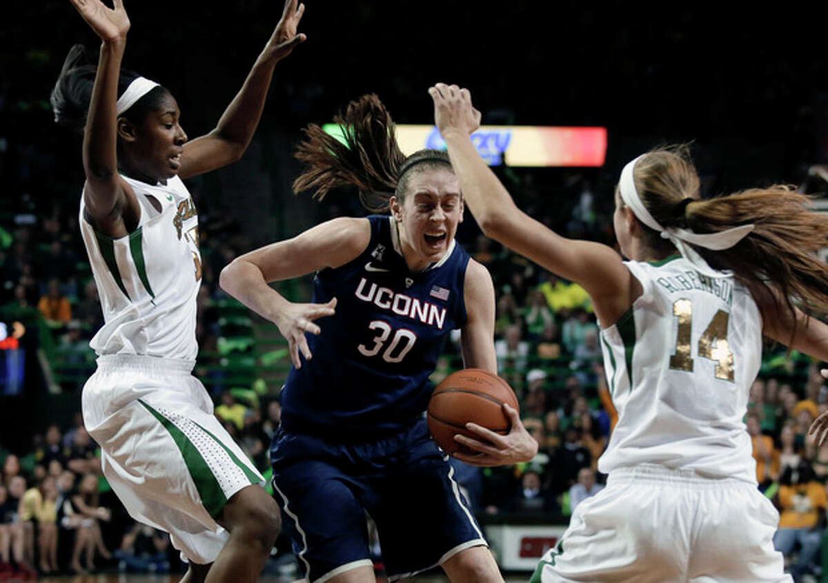 Baylor center Khadijiah Cave, left, and guard Makenzie Robertson (14) attempt to stop a drive to the basket by Connecticut's Breanna Stewart (30) in the first half of an NCAA college basketball game, Monday, Jan. 13, 2014, in Waco, Texas. (AP Photo/Tony Gutierrez)