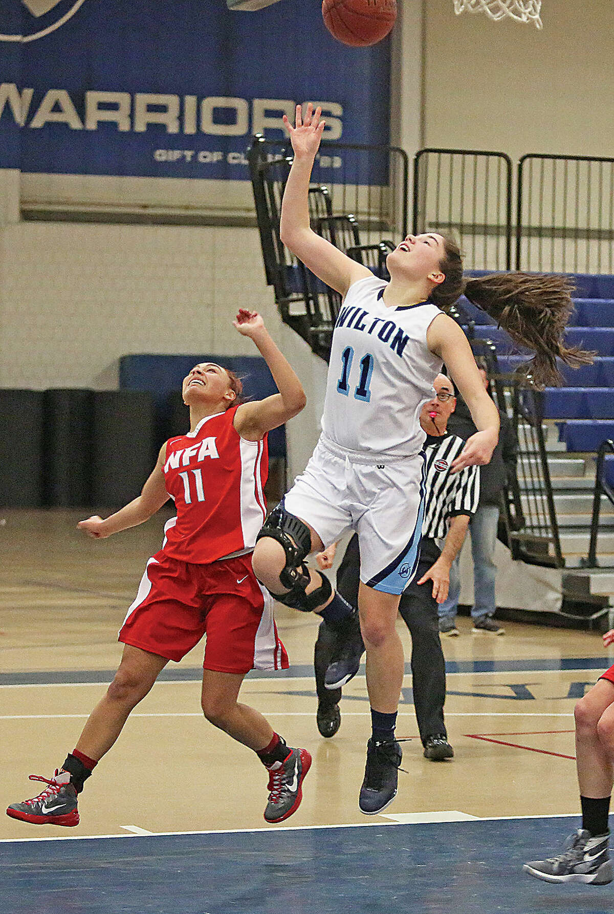 Wilton's #11, Sarah Fitzgerald, takes a shot during a home game against Norwich Free Academy Monday evening.