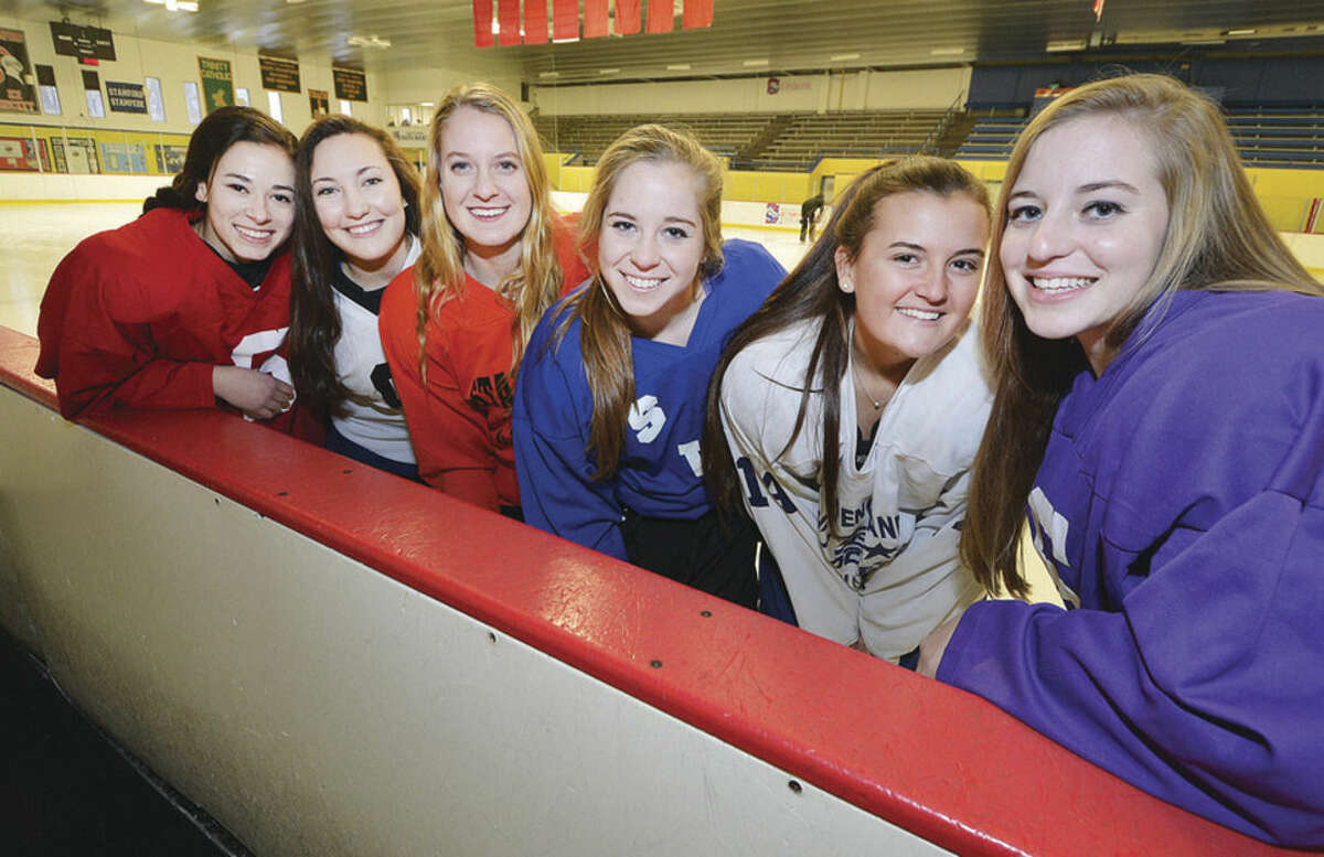 Photo by Alex von Kleydorff Key seniors for the Westhill-Stamford-Staples co-op girls hockey team include, from left, Ellie Grafstein, Jessica Mezias, Rachel Benz, Casandra Miolene, with Meg Fay and Claire Mioline.