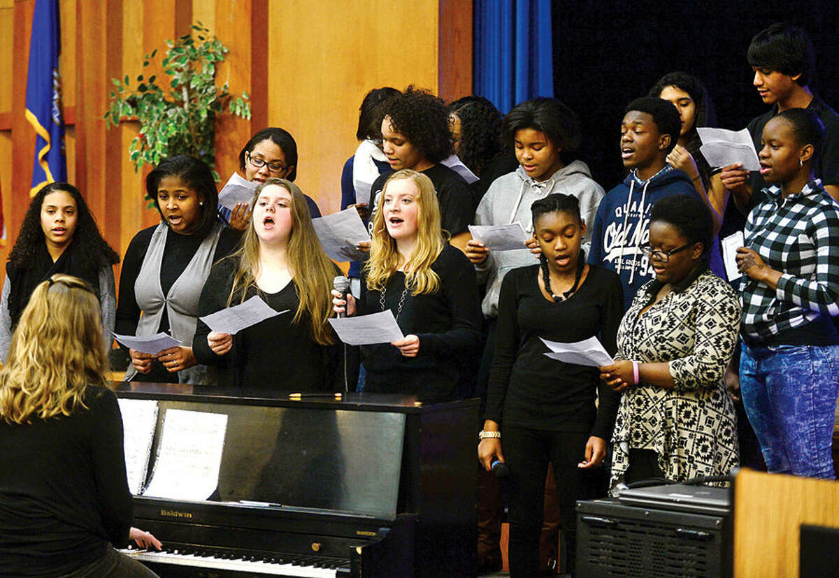 Hour photo / Erik Trautmann Ponus Ridge Middle School's 8th grade chorus sings during an assembly as part of the school's “100 Days of No Violence” agreement Thursday where students pledge to live peacefully over the next 100 days.