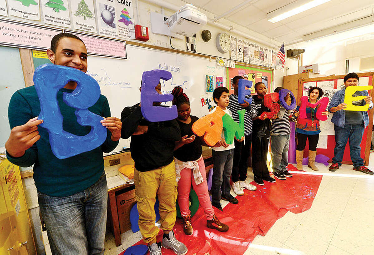Hour photo / Erik Trautmann West Rocks Middle School students in Melissa Fusarelli's art class make letters that spell out "Be Awesome" Thursday as part of the school's “100 Days of No Violence” agreement where the students pledge to live peacefully over the next 100 days.