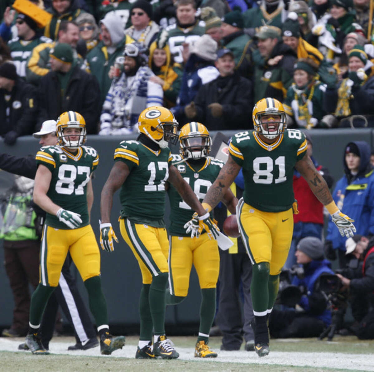 Green Bay Packers tight end Andrew Quarless (81) celebrates a touchdown during the first half of an NFL divisional playoff football game against the Dallas Cowboys Sunday, Jan. 11, 2015, in Green Bay, Wis. (AP Photo/Mike Roemer)
