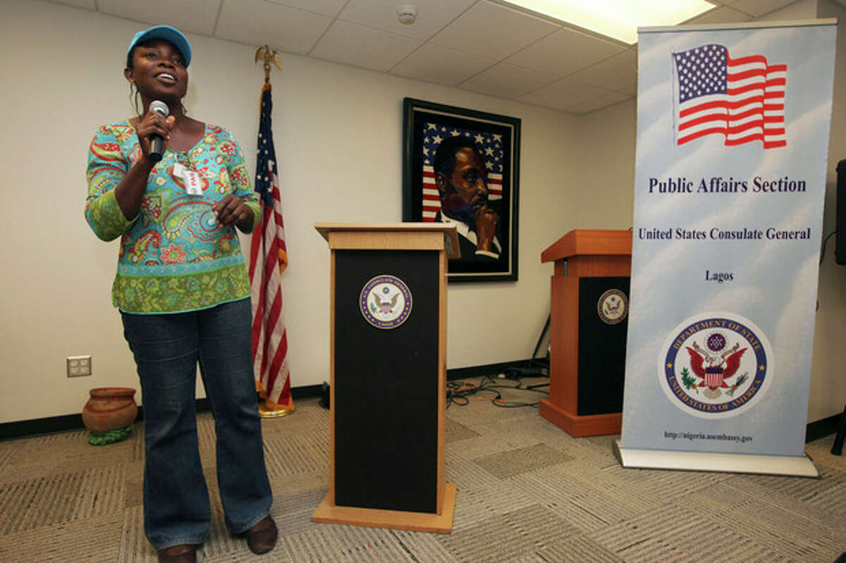 FILE - In this, Friday, Dec. 2, 2011 photo, Abosede Oladayo, 36, an AIDS activist living with HIV, speaks during an event to mark World Aids Day at the U.S Embassy in Lagos, Nigeria. Local and international groups fighting AIDS warned on Tuesday, Jan. 14, 2014, that a new Nigerian law criminalizing same-sex marriage and gay organizations will jeopardize the fight against the deadly disease. The United States, Britain and Canada condemned the law, with Secretary of State John Kerry saying Monday that it 'dangerously restricts freedom' of expression and association of all Nigerians.(AP Photo/Sunday Alamba, File)