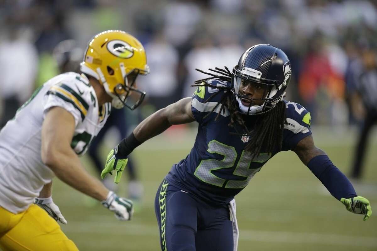 ADVANCE FOR WEEKEND EDITIONS, JAN. 17-18 - FILE - In this Sept. 4, 2014, file photo, Seattle Seahawks cornerback Richard Sherman (25) begins pass coverage against the Green Bay Packers in the second half of an NFL football game in Seattle. After they opened the 2014 NFL season in early September, it seemed inevitable that Aaron Rodgers would get a second chance to throw at Richard Sherman _ if he wanted to.(AP Photo/Stephen Brashear, File)