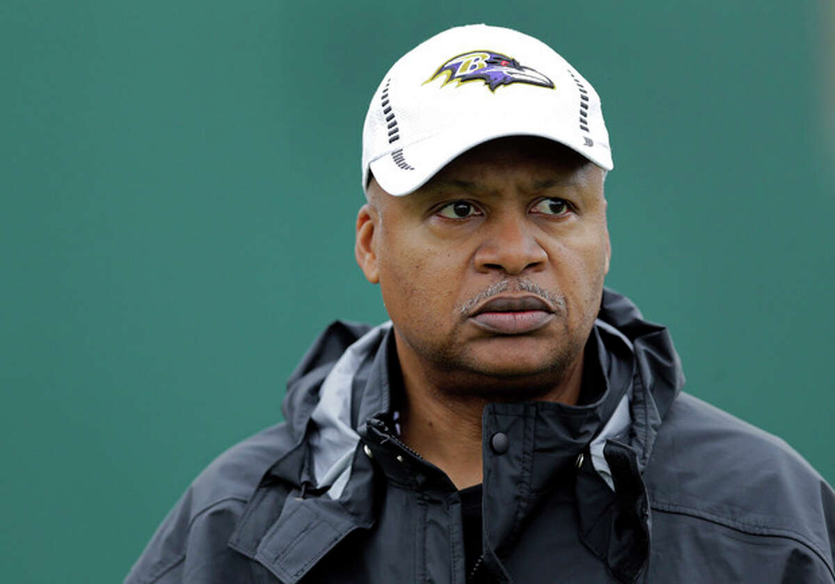 FILE - In this Jan. 30, 2013, file photo, Baltimore Ravens offensive coordinator Jim Caldwell walks onto the field as his team warms up during an NFL Super Bowl XLVII football practice in New Orleans. A person familiar with the situation says the Detroit Lions have hired coach Caldwell. (AP Photo/Patrick Semansky, File)