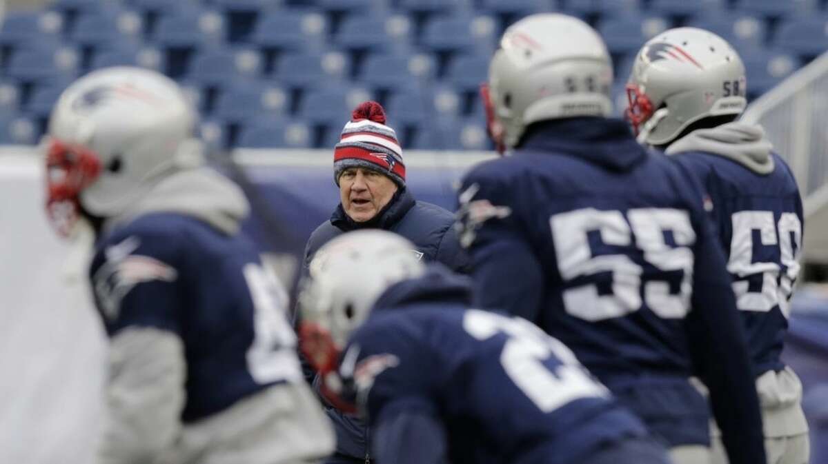 New England Patriots head coach Bill Belichick, rear, calls to his players during NFL football practice at Gillette Stadium in Foxborough, Mass., Wednesday, Jan. 14, 2015. The Patriots face the Indianapolis Colts in the AFC Championship game on Sunday. (AP Photo/Charles Krupa)