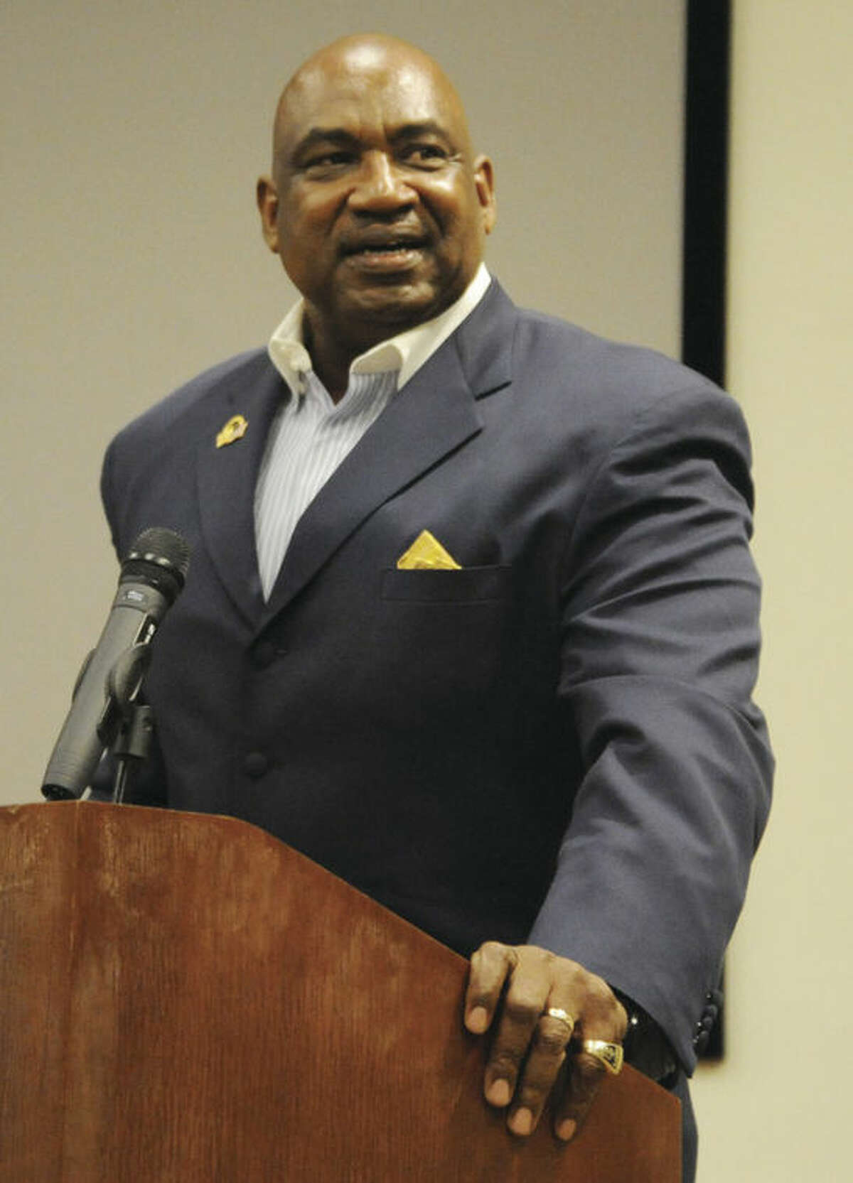 Hour photo/Matthew Vinci George Martin, a former defensive lineman for the New York Giants, addresses the crowd Tuesday night during his talk about civility on the gridiron at Stamford's Ferguson Library. Martin spent 14 years in the NFL, all with the Giants.