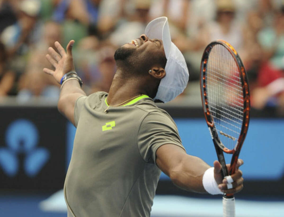 Donald Young of the U.S. celebrates after defeating Andreas Seppi of Italy in their second round match at the Australian Open tennis championship in Melbourne, Australia, Thursday, Jan. 16, 2014. (AP Photo/Andrew Brownbill)
