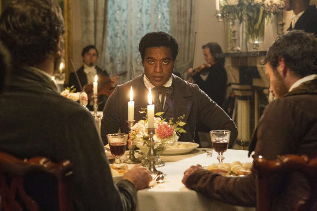 This film publicity image released by Fox Searchlight shows Chiwetel Ejiofor in a scene from "12 Years A Slave." This year's best picture race at the 86th Academy Awards on Sunday, March 2, 2014, has shaped up to be one of the most unpredictable in years. The favorites are "12 Years a Slave," "Gravity" and "American Hustle." (AP Photo/Fox Searchlight Films, Jaap Buitendijk, file)