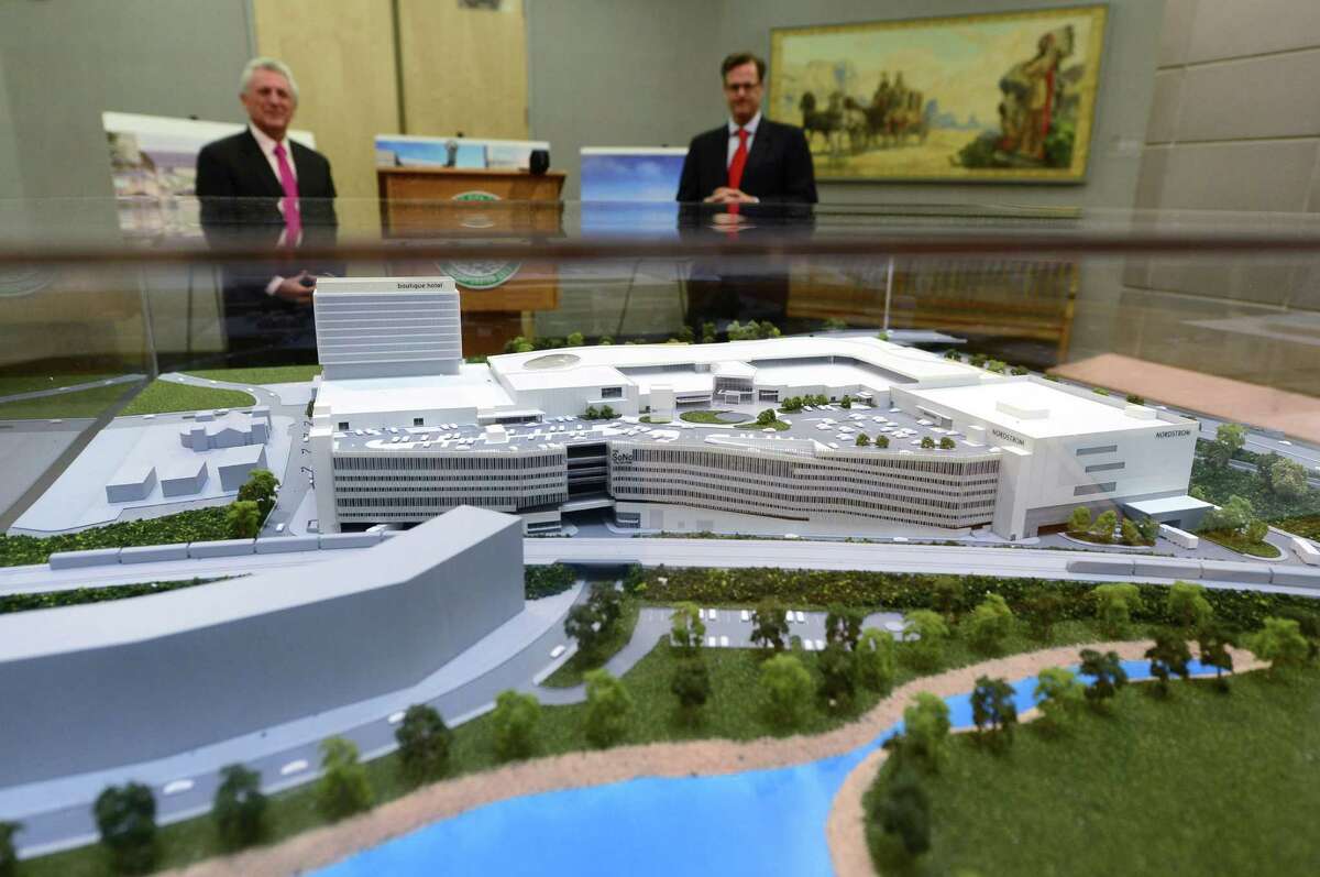 Norwalk Mayor Harry Rilling and Doug Adams of developer General Growth Properties (L-R) take in a model of The SoNo Collection shopping mall planned for Norwalk, Conn. in 2018.