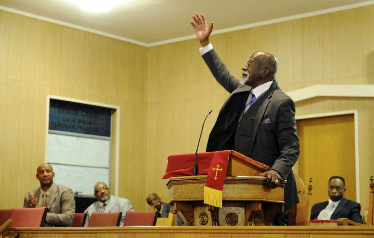Dr. Anthony Brooks ends his keynote speech celebrating the life and work of Dr. Martin Luther King, Jr. during the Henderson County Black History Committee's program at Greater Norris Chapel Baptist Church in Henderson, Ky Sunday Jan. 19, 2014. (AP Photo/The Gleaner, Darrin Phegley)