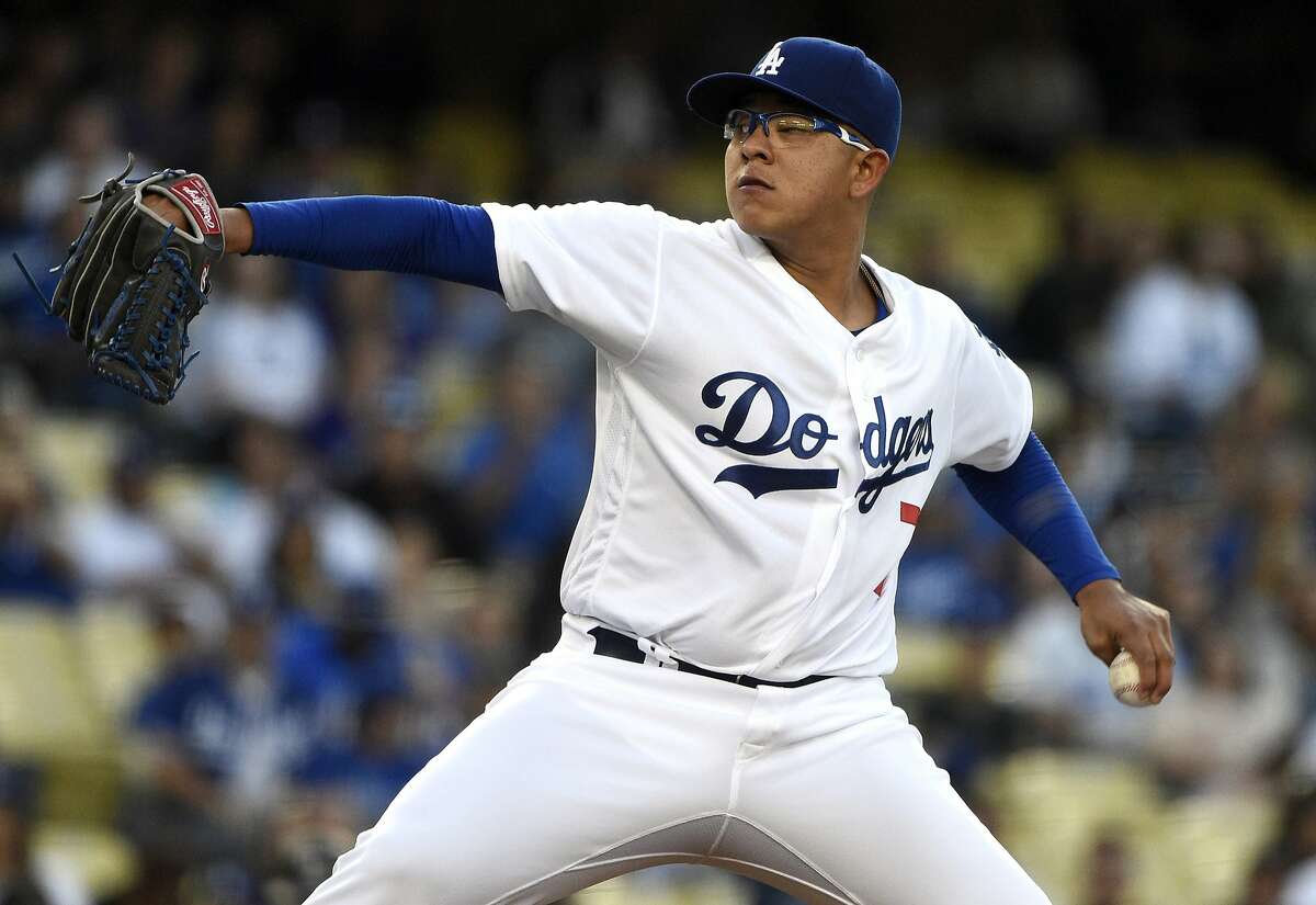 Members of the Wrigley Little League Dodgers of Los Angeles wear